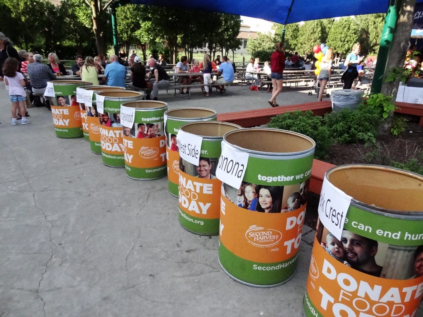 People donating food at the park to help those in need
