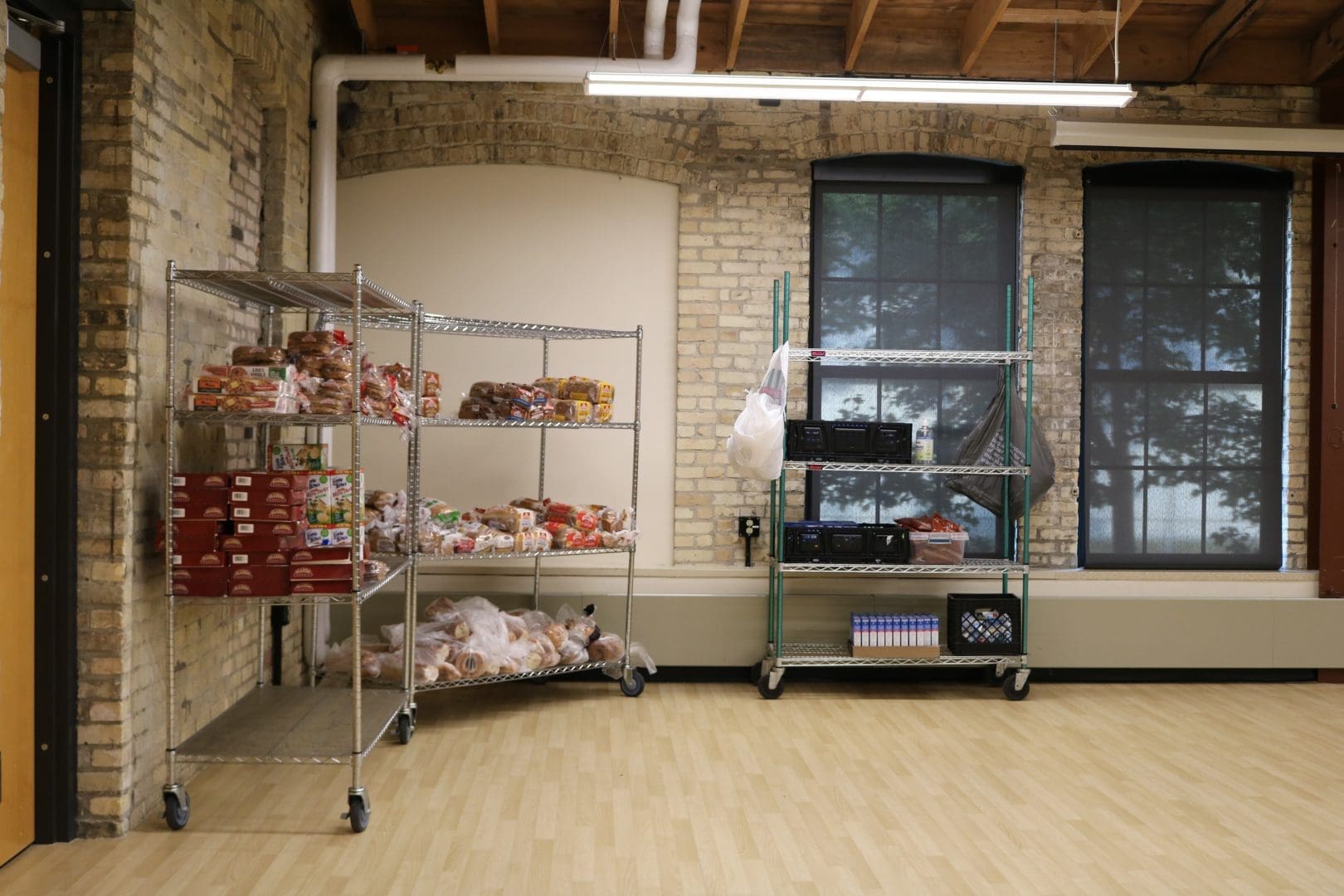 Clean food pantry storage room with metal shelving