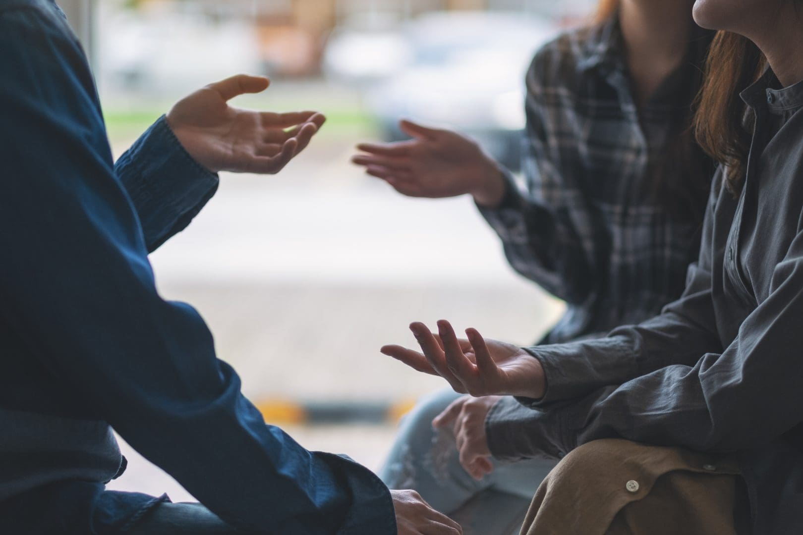 Two people sitting and talking together