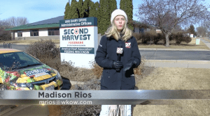 News reporter outside of Second Harvest Foodbank in Madison Wisconsin.