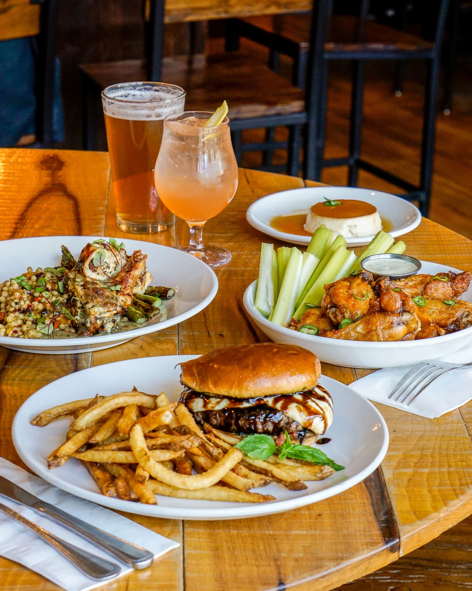 Burger and fries with colorful drinks.