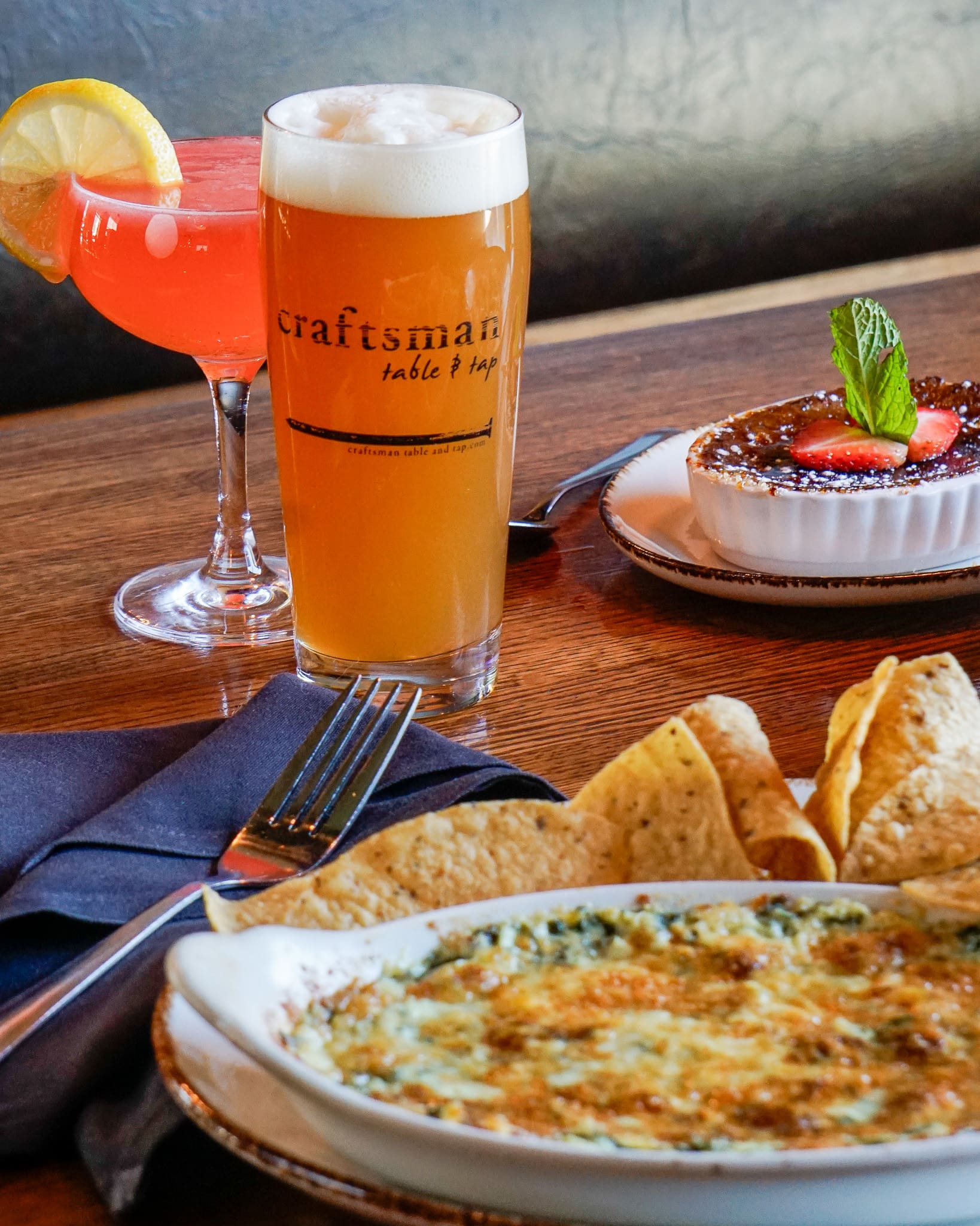 Chips and dip with colorful drinks.