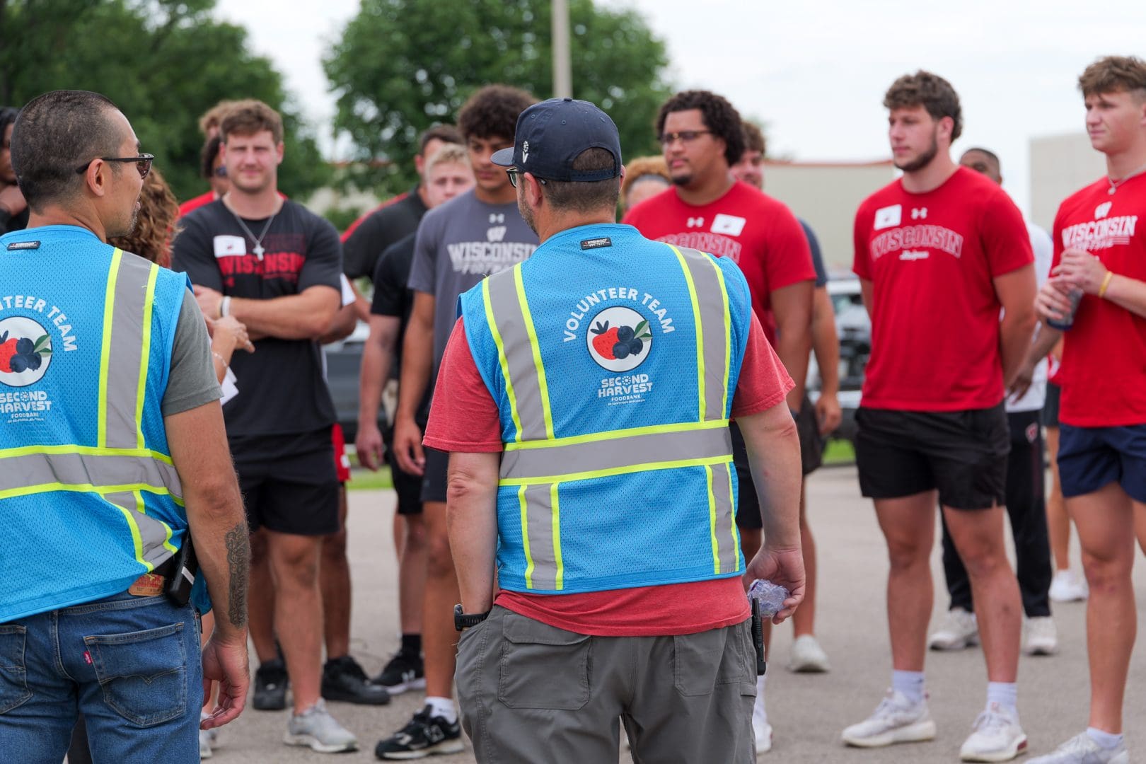 Badger football players learning about food banking