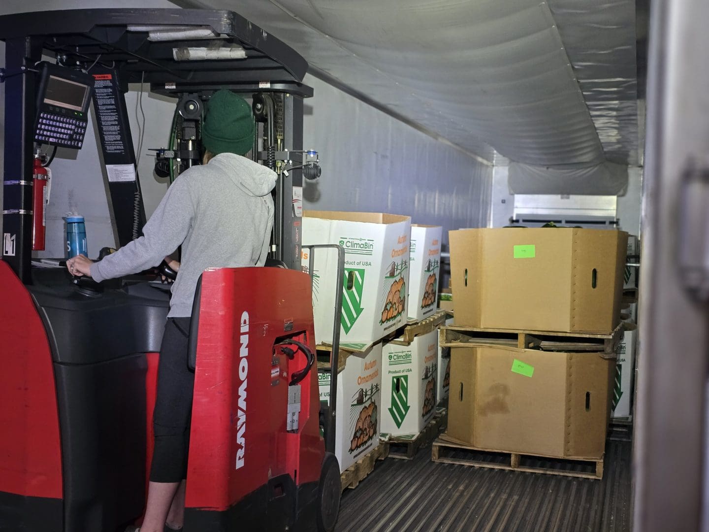 Fresh produce is unloaded from a semi into second harvests distribution center