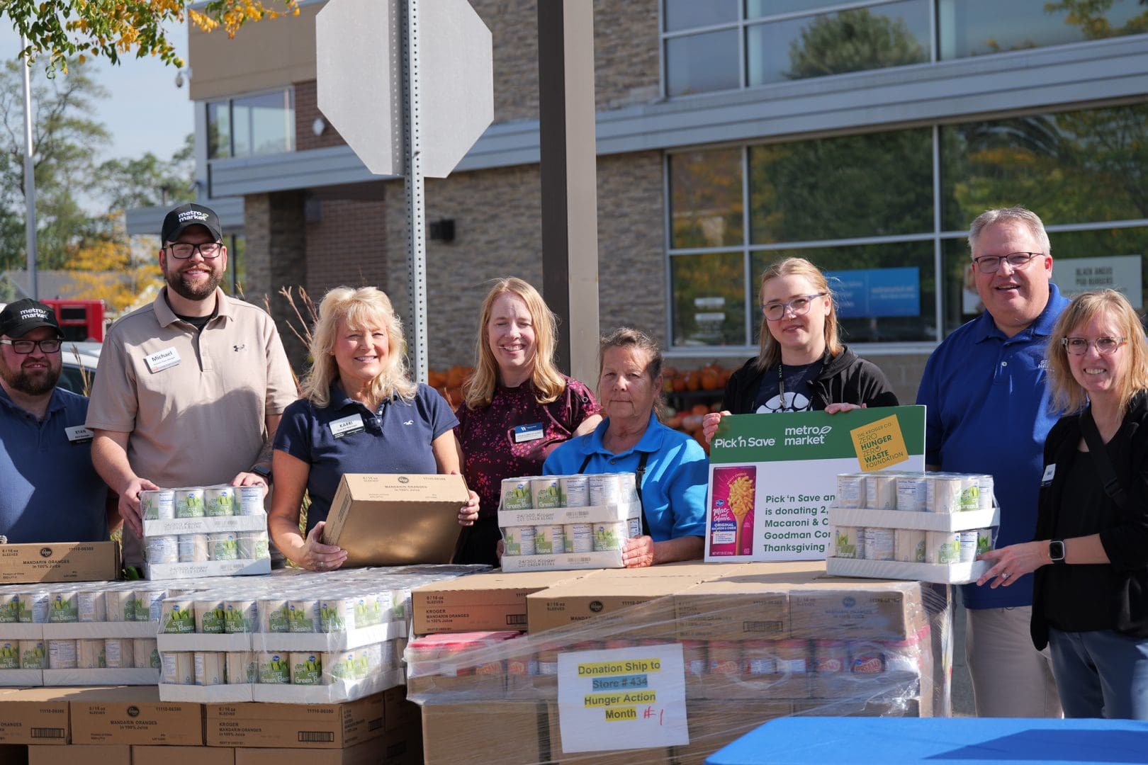 Second harvest staff and partners with rescued food at a pantry