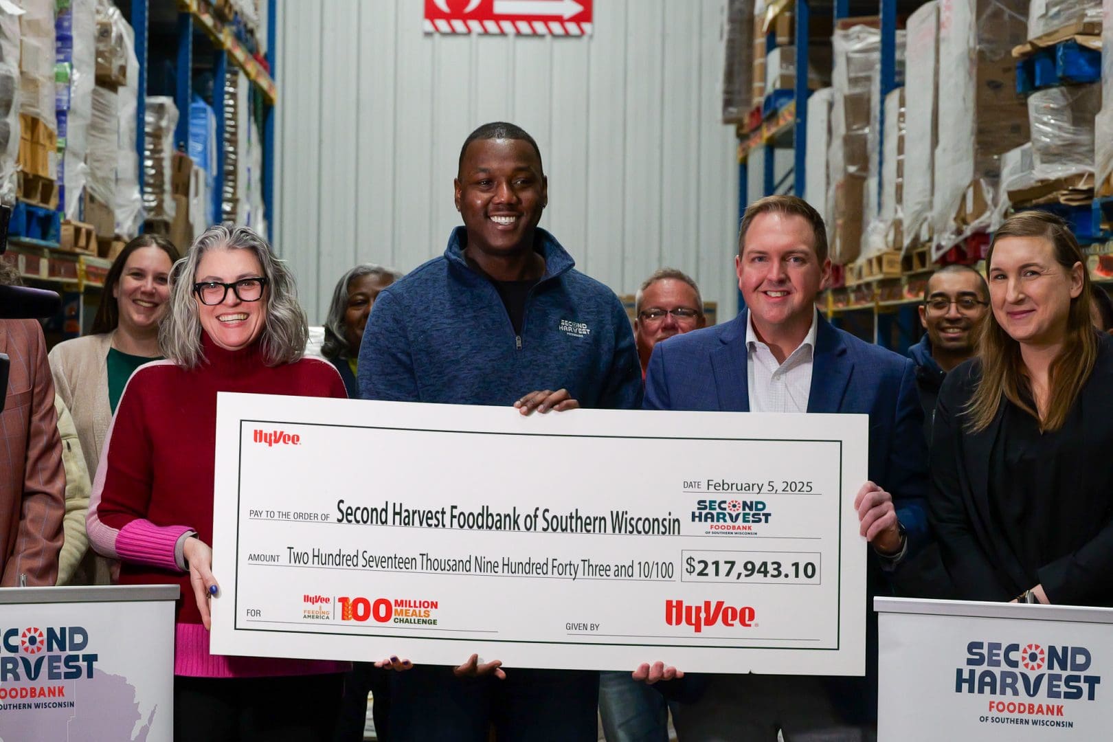 Hy vee check presentation to second harvest foodbank for the 100 million meals challenge